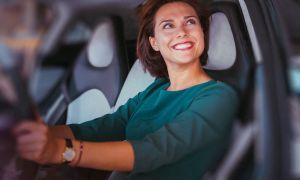 Woman smiling in new car