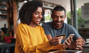 Couple smiling at desk