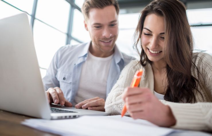 Man and woman on laptop